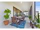 Beautiful covered patio with dining furniture and decor and ample natural light at 13891 Heartwood Way, Parrish, FL 34219