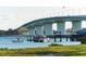 Scenic view of a modern bridge over blue water with a boat dock in the foreground at 240 Sands Point Rd # 4201, Longboat Key, FL 34228