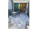 Inviting outdoor patio boasts tranquil lake views and stylish seating, ideal for relaxation at 6404 Silverstar Dr, Sarasota, FL 34240