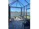 Bask in scenic water views from this relaxing screened-in patio with ample seating and a peaceful atmosphere at 6404 Silverstar Dr, Sarasota, FL 34240