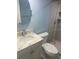 Bathroom featuring a modern sink, toilet, and shower with tiled walls at 9400 Ridge Rd, Seminole, FL 33772
