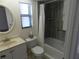 Neutral bathroom with a shower-tub combo and ample natural light at 9400 Ridge Rd, Seminole, FL 33772