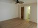 Neutral bedroom showcasing a ceiling fan, closet and bathroom access at 9400 Ridge Rd, Seminole, FL 33772