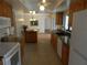 Well-lit kitchen with modern appliances, granite countertops, and wooden cabinets at 9400 Ridge Rd, Seminole, FL 33772