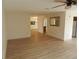 Spacious living room showcasing wood-look floors and neutral paint at 9400 Ridge Rd, Seminole, FL 33772