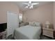 Comfortable bedroom featuring a full bed, nightstands, and a closet for ample storage at 9606 Sea Turtle Ter # 101, Bradenton, FL 34212