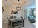 Inviting dining room with a modern chandelier, stylish table setting, and comfortable seating at 9606 Sea Turtle Ter # 101, Bradenton, FL 34212