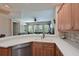 Modern kitchen featuring stainless steel appliances, granite countertops, and a seamless transition to the living area at 9606 Sea Turtle Ter # 101, Bradenton, FL 34212