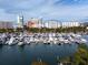 A view of the condo from above the marina filled with boats docked on the water at 101 S Gulfstream Ave # 10E, Sarasota, FL 34236