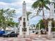 Striking entrance to Sarasota Bayfront with an archway, landscaping, and access to marina amenities at 101 S Gulfstream Ave # 10E, Sarasota, FL 34236