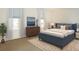Comfortable bedroom with plush blue furnishings and lots of natural light at 101 S Gulfstream Ave # 10E, Sarasota, FL 34236