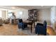 Cozy common area with a chessboard, a bookshelf, and comfortable armchairs, perfect for reading and relaxing at 101 S Gulfstream Ave # 10E, Sarasota, FL 34236