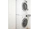The laundry area features a stacked washer and dryer set, conveniently located for easy access at 101 S Gulfstream Ave # 10E, Sarasota, FL 34236