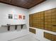 Functional mailroom with individual mailboxes, a convenient countertop, and bulletin board for community announcements at 101 S Gulfstream Ave # 10E, Sarasota, FL 34236