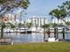 Scenic marina view featuring numerous boats docked against a backdrop of modern city buildings at 101 S Gulfstream Ave # 10E, Sarasota, FL 34236