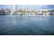 Picturesque view of the marina filled with boats, set against a cityscape backdrop under a bright sky at 101 S Gulfstream Ave # 10E, Sarasota, FL 34236