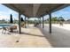 Outdoor pool deck with lounge chairs, dining tables, and clear views offering the perfect space for relaxation and social gatherings at 101 S Gulfstream Ave # 10E, Sarasota, FL 34236
