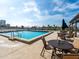 Stunning rooftop pool with clear blue water and a cityscape backdrop offering a perfect setting for leisure and relaxation at 101 S Gulfstream Ave # 10E, Sarasota, FL 34236