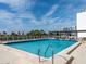 Bright rooftop pool with clear blue water and city skyline views, providing an ideal setting for relaxation and enjoyment at 101 S Gulfstream Ave # 10E, Sarasota, FL 34236
