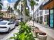 Charming street view with lush planters, benches, and storefronts creating a welcoming pedestrian experience at 101 S Gulfstream Ave # 10E, Sarasota, FL 34236