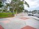 Scenic waterfront walkway with geometric pavers, trees, and boat docks offering a relaxing stroll at 101 S Gulfstream Ave # 10E, Sarasota, FL 34236