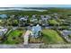 Stunning aerial view of waterfront home with lush landscaping at 1825 Bayshore Dr, Terra Ceia, FL 34250