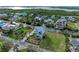 An aerial shot showcases the beautiful home nestled on a waterfront lot at 1825 Bayshore Dr, Terra Ceia, FL 34250