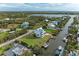 Beautiful waterfront property with boat docks, lush landscaping, and sparkling waterways at 1825 Bayshore Dr, Terra Ceia, FL 34250