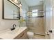 Updated bathroom featuring a glass-enclosed shower, modern fixtures, and a sleek vanity at 1825 Bayshore Dr, Terra Ceia, FL 34250
