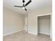 Neutral bedroom features include tile floors, an open closet, and plenty of room for customization at 1825 Bayshore Dr, Terra Ceia, FL 34250