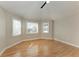 Bright bedroom with hardwood floors, neutral walls, and windows for lots of natural light at 1825 Bayshore Dr, Terra Ceia, FL 34250