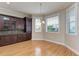Dining area featuring custom built-ins and natural light from the windows with views at 1825 Bayshore Dr, Terra Ceia, FL 34250