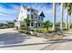 Stately two-story home with lush landscaping, a circular driveway, and ample curb appeal at 1825 Bayshore Dr, Terra Ceia, FL 34250