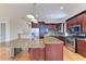 Open kitchen with large island, stainless steel appliances, and custom cabinets at 1825 Bayshore Dr, Terra Ceia, FL 34250