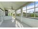 Screened lanai providing peaceful views of the water and nearby homes at 1825 Bayshore Dr, Terra Ceia, FL 34250