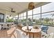 Outdoor dining area with patio table, chairs, and views of the neighborhood at 1825 Bayshore Dr, Terra Ceia, FL 34250