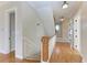 Bright entryway with staircase, wood floors, and decorative trim at 1825 Bayshore Dr, Terra Ceia, FL 34250