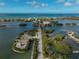 Scenic aerial view of road leading to home in a waterfront community at 304 Pine Run Dr, Osprey, FL 34229