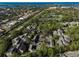Scenic aerial shot capturing the expansive residential community with stunning ocean views at 304 Pine Run Dr, Osprey, FL 34229