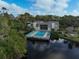 Stunning aerial perspective featuring a pool and surrounding lush landscape at 304 Pine Run Dr, Osprey, FL 34229