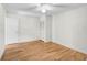 Well-lit bedroom featuring hardwood floors, neutral walls, and a ceiling fan at 304 Pine Run Dr, Osprey, FL 34229