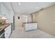 Bright kitchen with white cabinets and granite countertops at 304 Pine Run Dr, Osprey, FL 34229