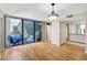 Bright living room featuring hardwood floors and sliding glass doors to a private outdoor patio at 304 Pine Run Dr, Osprey, FL 34229