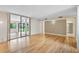 Spacious Living room with hardwood floors and access to the Lanai and Kitchen at 304 Pine Run Dr, Osprey, FL 34229