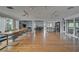 Spacious and open living area with wood floors, natural light, and comfortable seating arrangement at 304 Pine Run Dr, Osprey, FL 34229