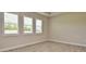 Clean and spacious bedroom featuring tile floors and plantation shutters at 4326 Silo Port Ct, Lakewood Ranch, FL 34211