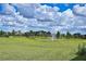 Beautiful community green space with fountain, trees, and well-maintained grass at 4326 Silo Port Ct, Lakewood Ranch, FL 34211