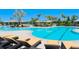 Stunning community pool with comfortable lounge chairs and umbrellas for relaxation at 4326 Silo Port Ct, Lakewood Ranch, FL 34211