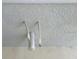 Close-up of the home's exterior with visible pipes and textured wall at 4326 Silo Port Ct, Lakewood Ranch, FL 34211