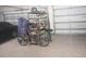 View of an organized garage space with epoxy flooring at 4326 Silo Port Ct, Lakewood Ranch, FL 34211
